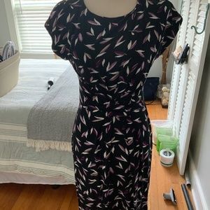 Knit dress with side rauching